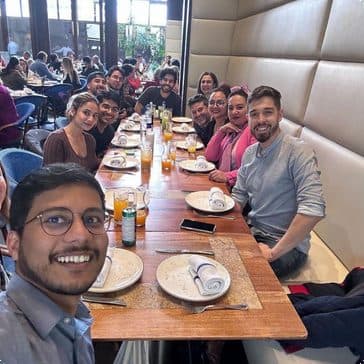 The OnlyAI team together at a long dinner table