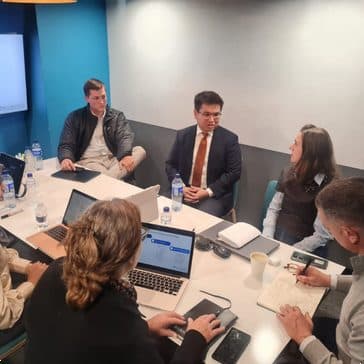 OnlyAI team leading a client workshop around a conference table